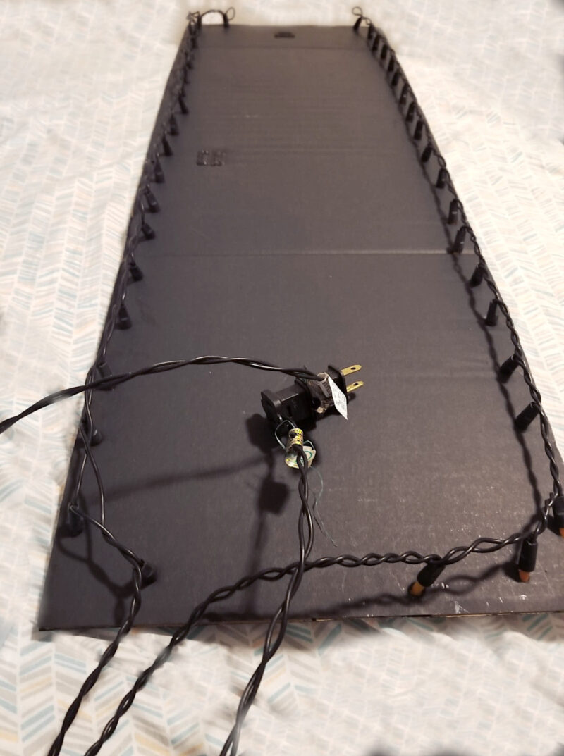 attaching lights halloween sign back