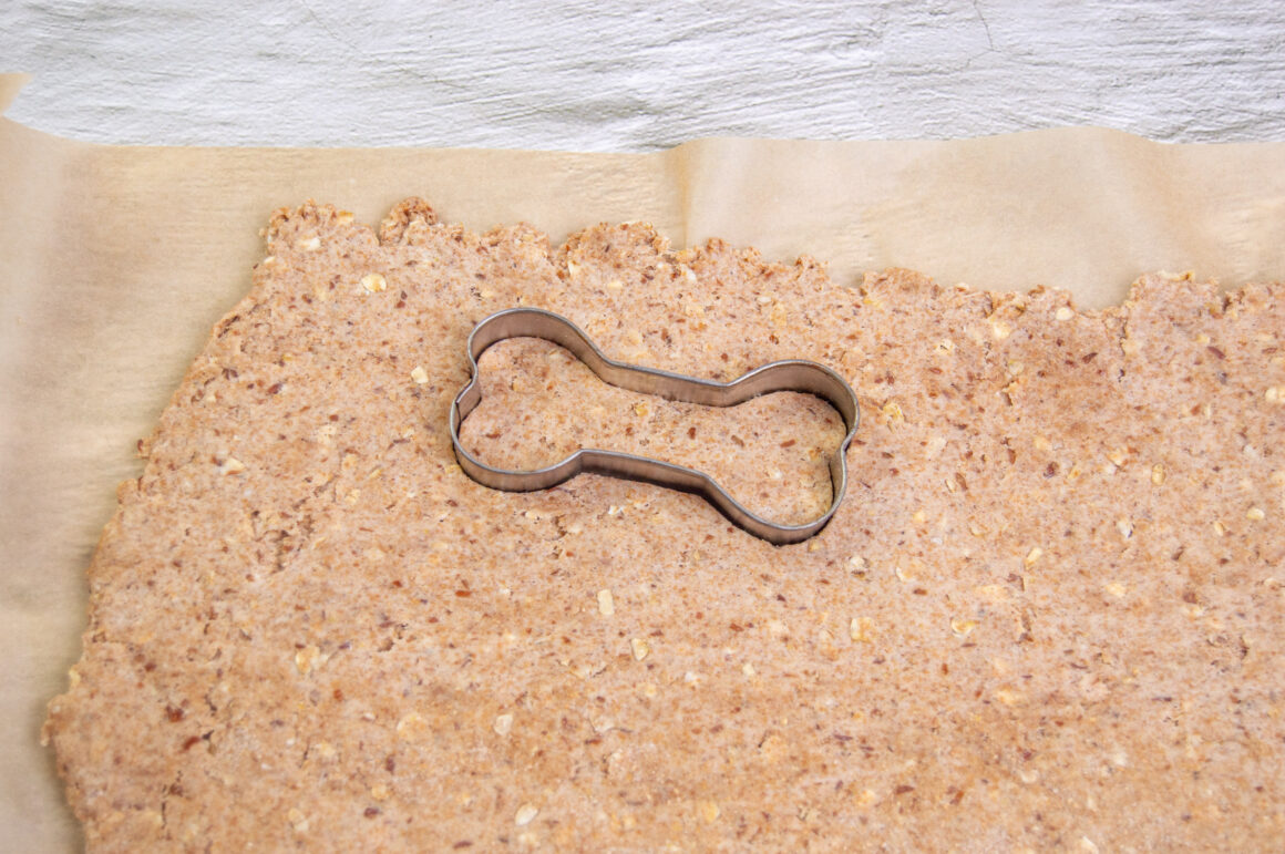 cutting out the bone shaped dog treats 