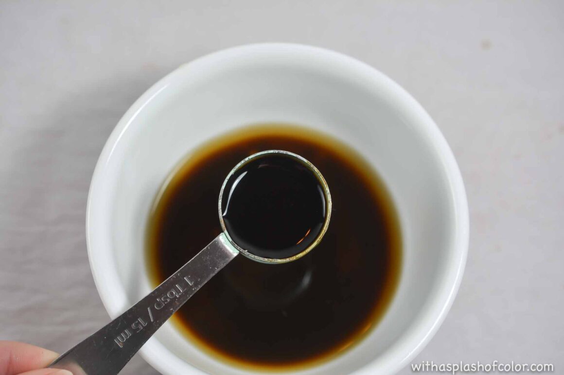 adding soy sauce to the mixture 