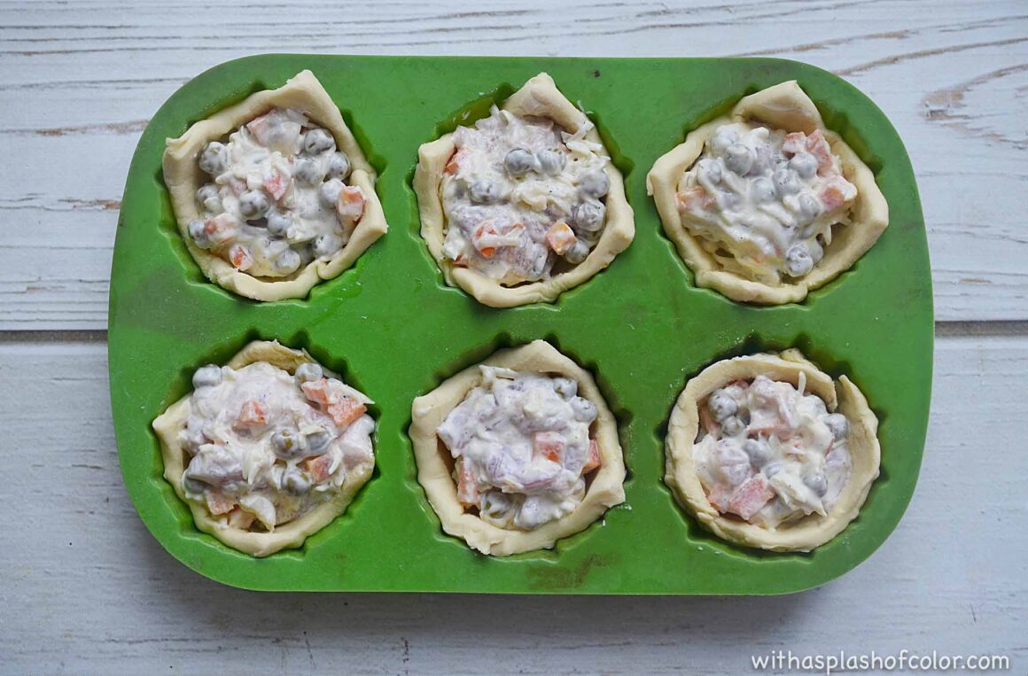 filling the pastry with the chicken ingredients 