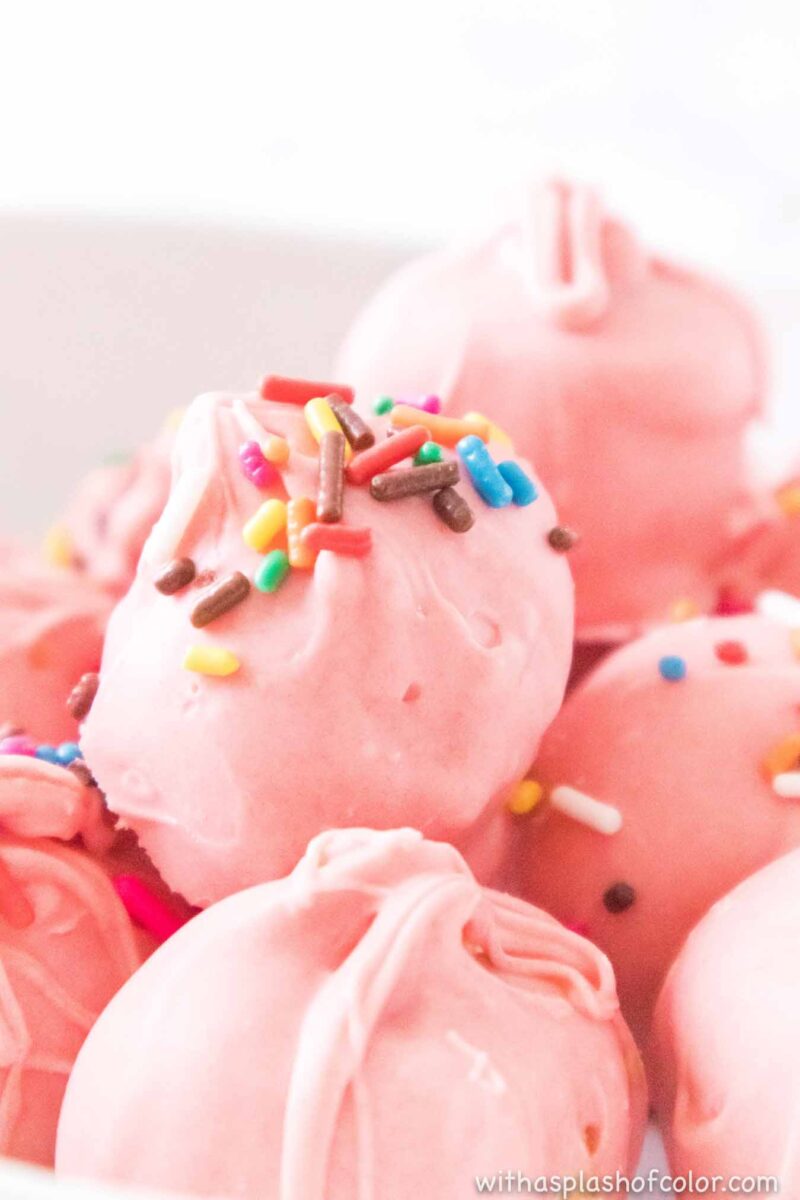pile of pink truffles topped with sprinkles