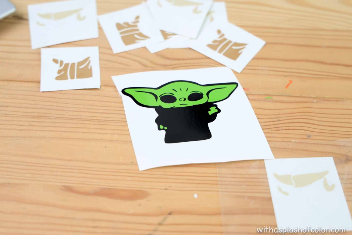 putting the vinyl pieces together to make baby yoda