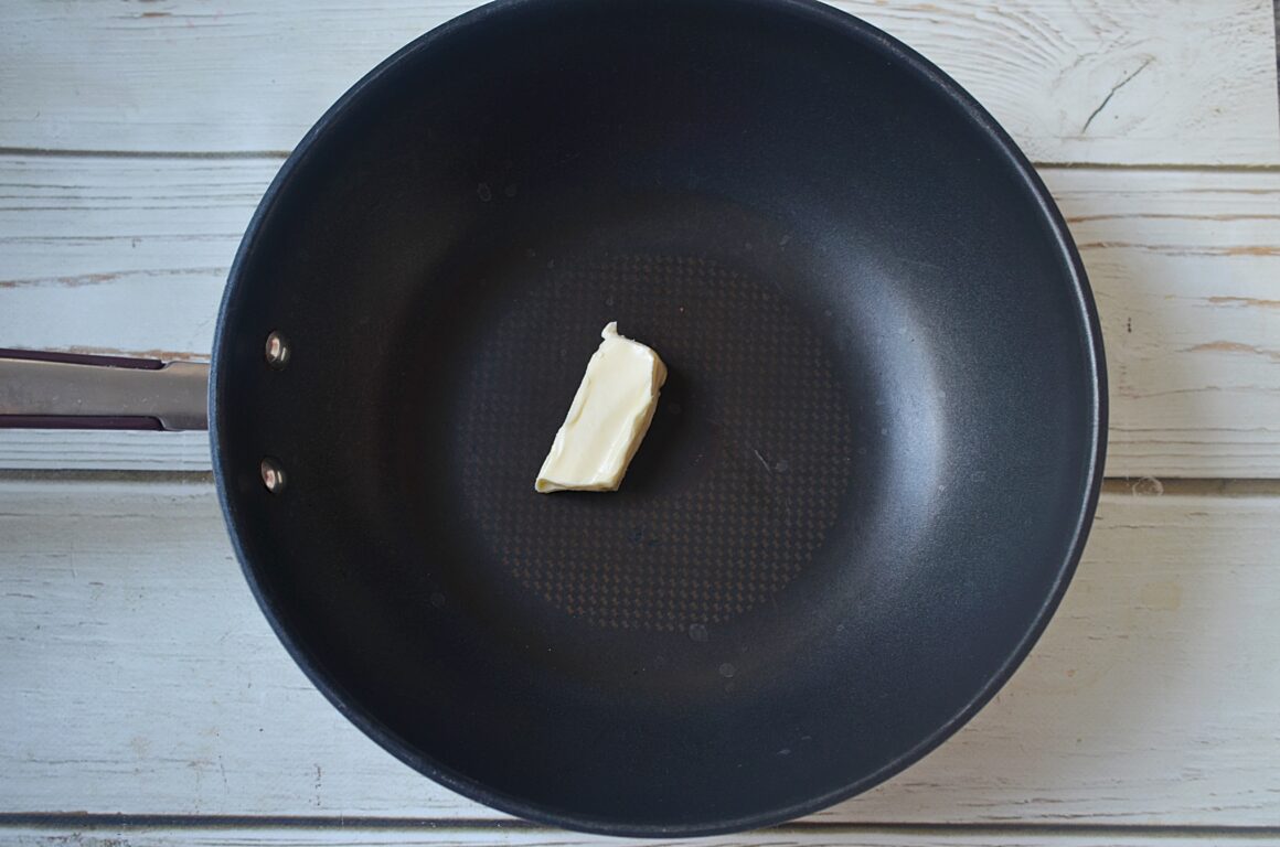 adding butter to the skillet